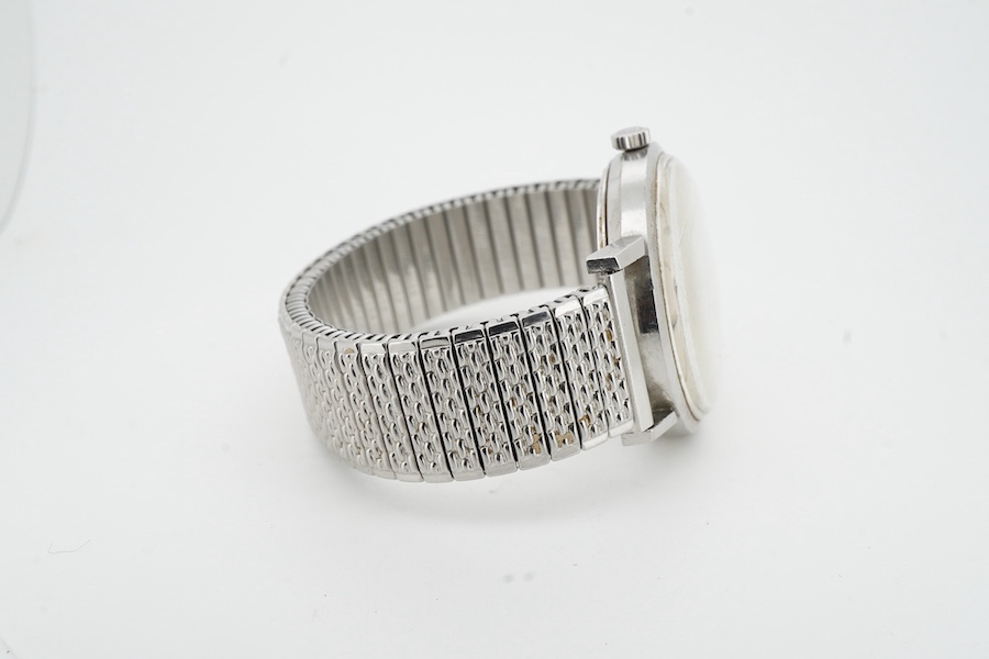 Longines, a stainless steel automatic wristwatch, ref.7844-3, 1960s, circular brushed silvered dial with baton indicators and date wheel aperture, dial and movement signed Longines, case back interior signed Longines, nu
